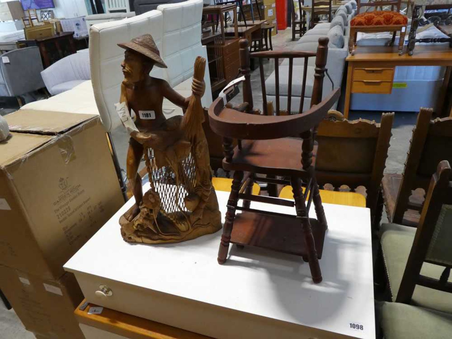Dolls high chair and carved wooden statue of fisherman