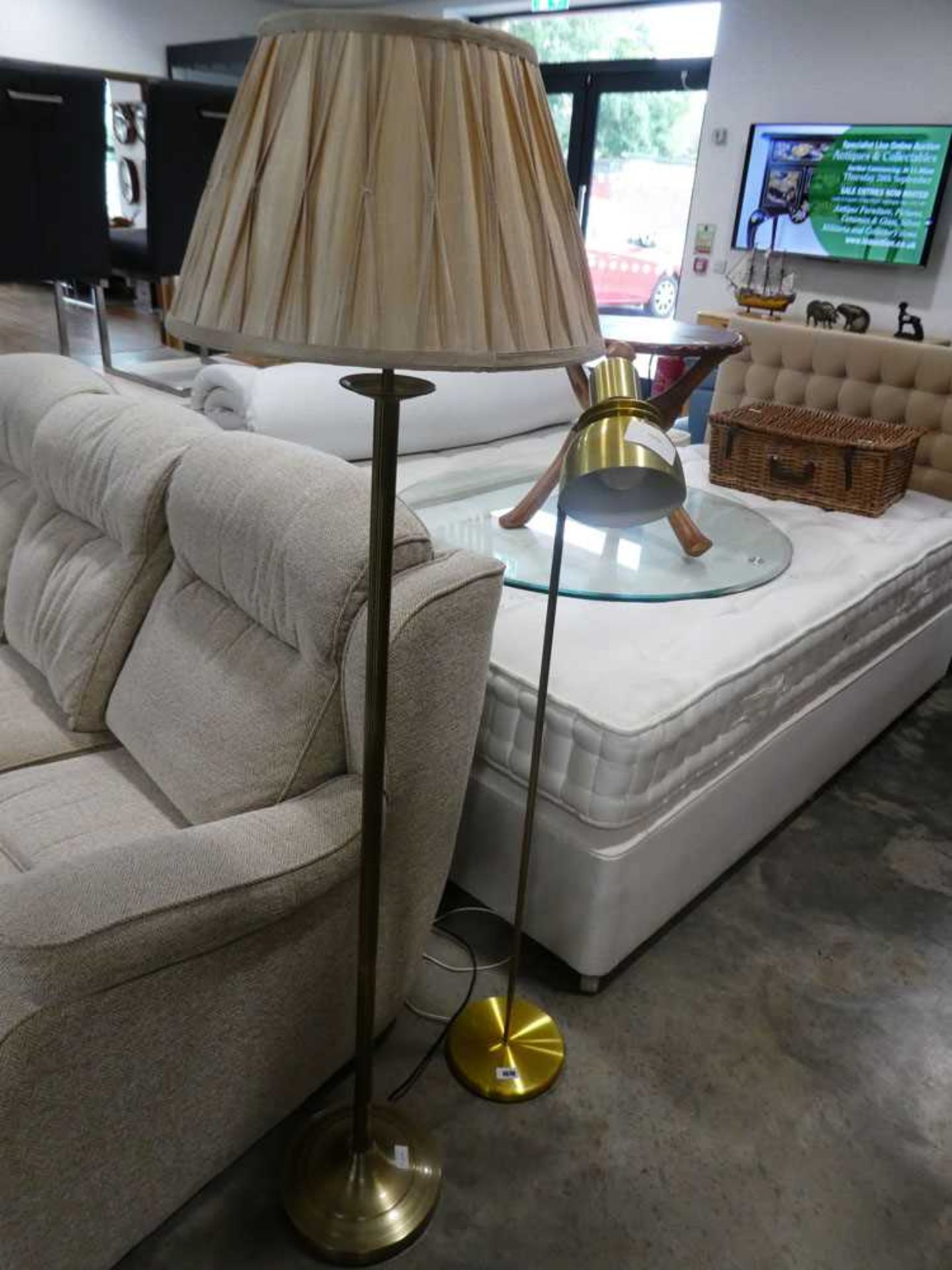 Brass effect standard lamp with ruffled cream shade and single brass floor standing spotlight