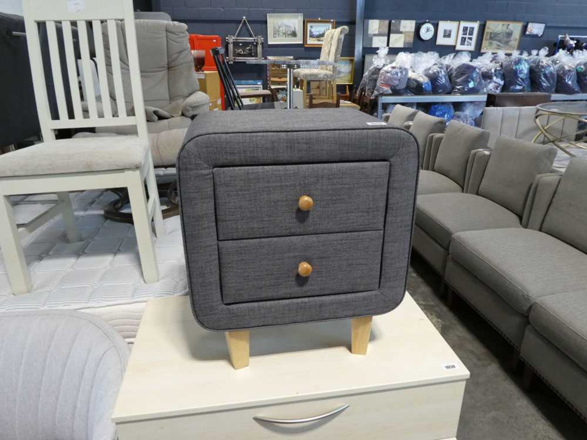 Modern grey upholstered 2 drawer bedside on beech supports