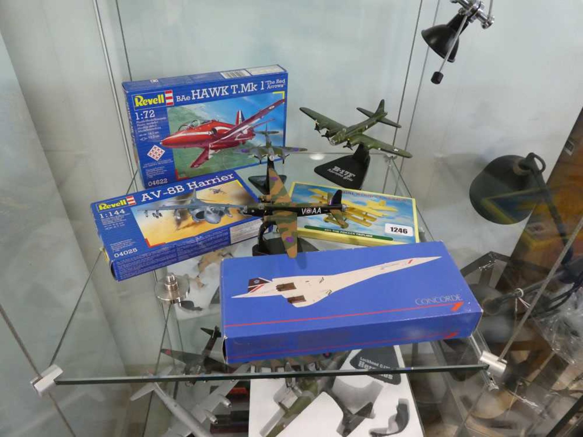 2 shelves of model airplanes incl. Revell kits (BAe Hawk T.Mk 1 Red Arrow & AV-8B Harrier) and scale