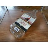 Glass wall clock in the form of flatted Famous Grouse bottle