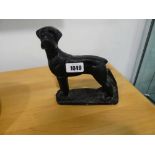 Case iron door stop in the form of a dog