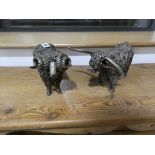 Pair of bronze effect ornaments; highland cow and ram