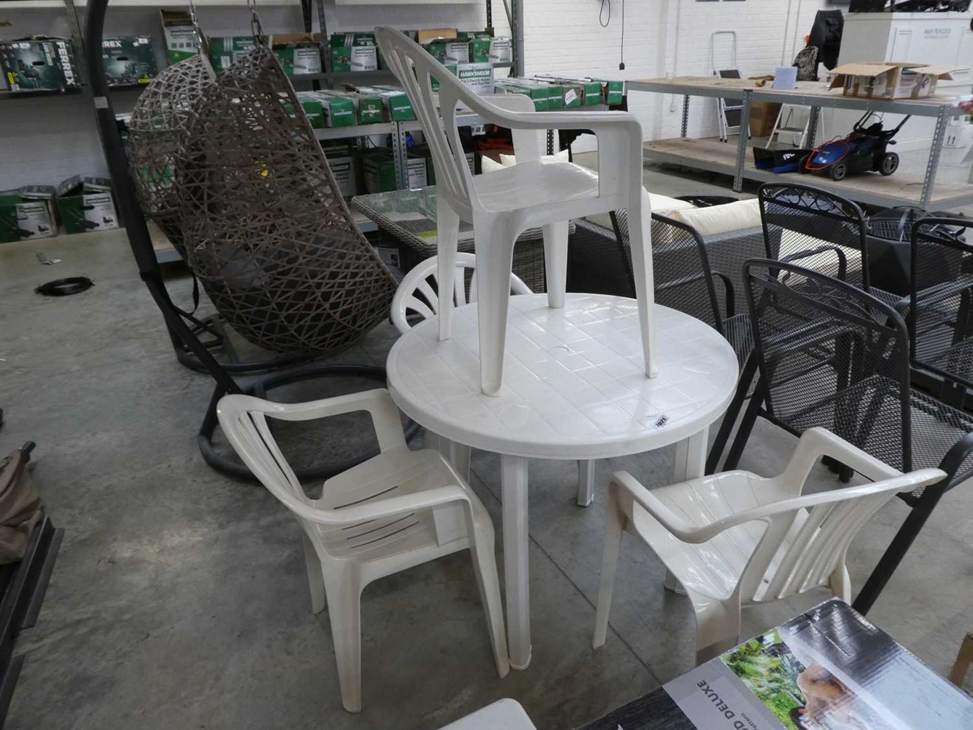 White plastic 5 piece outdoor garden seating set comprising circular table and 4 chairs