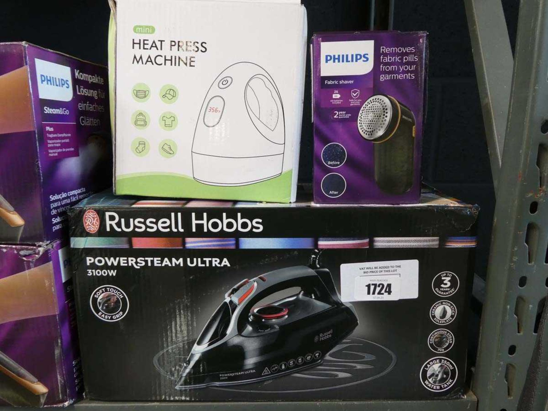 +VAT Russell Hobbs Power Steam Ultra iron, together with a Philips fabric shaver and mini heat press