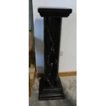 Modern black and white painted pot stand in form of column