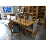 Modern oak effect extending dining table and 4 matching black leather upholstered dining chairs
