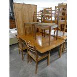 Mid Century teak drop leaf dining table with 4 matching brown upholstered dining chairs