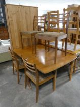 Mid Century teak drop leaf dining table with 4 matching brown upholstered dining chairs