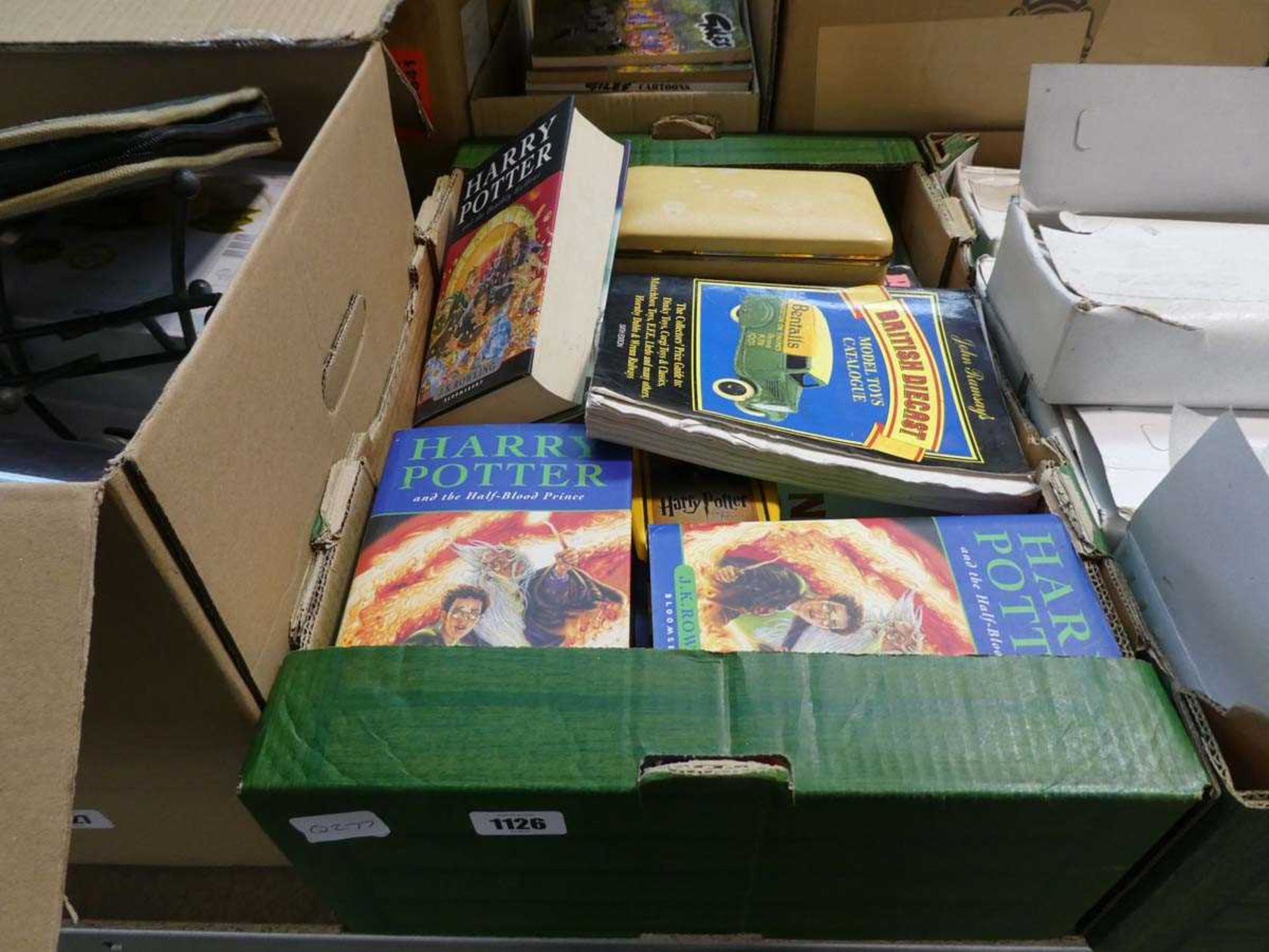 Crate containing books incl. Harry Potter, record collector's price guide, etc.