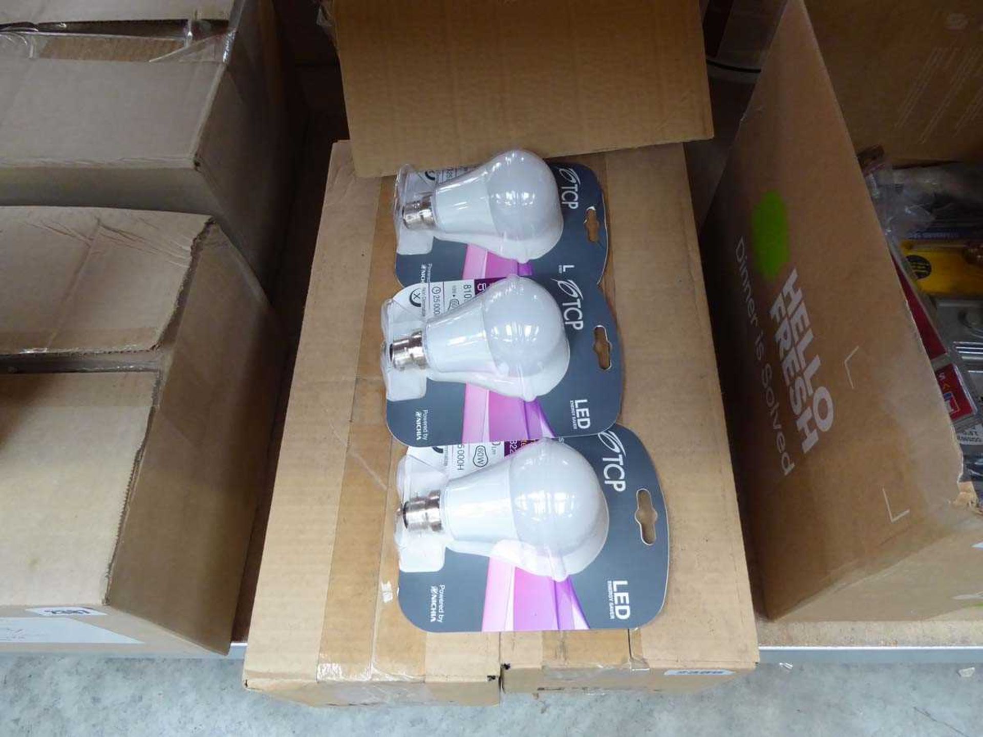 2 boxes containing a quantity TCP branded LED warm white light bulbs,