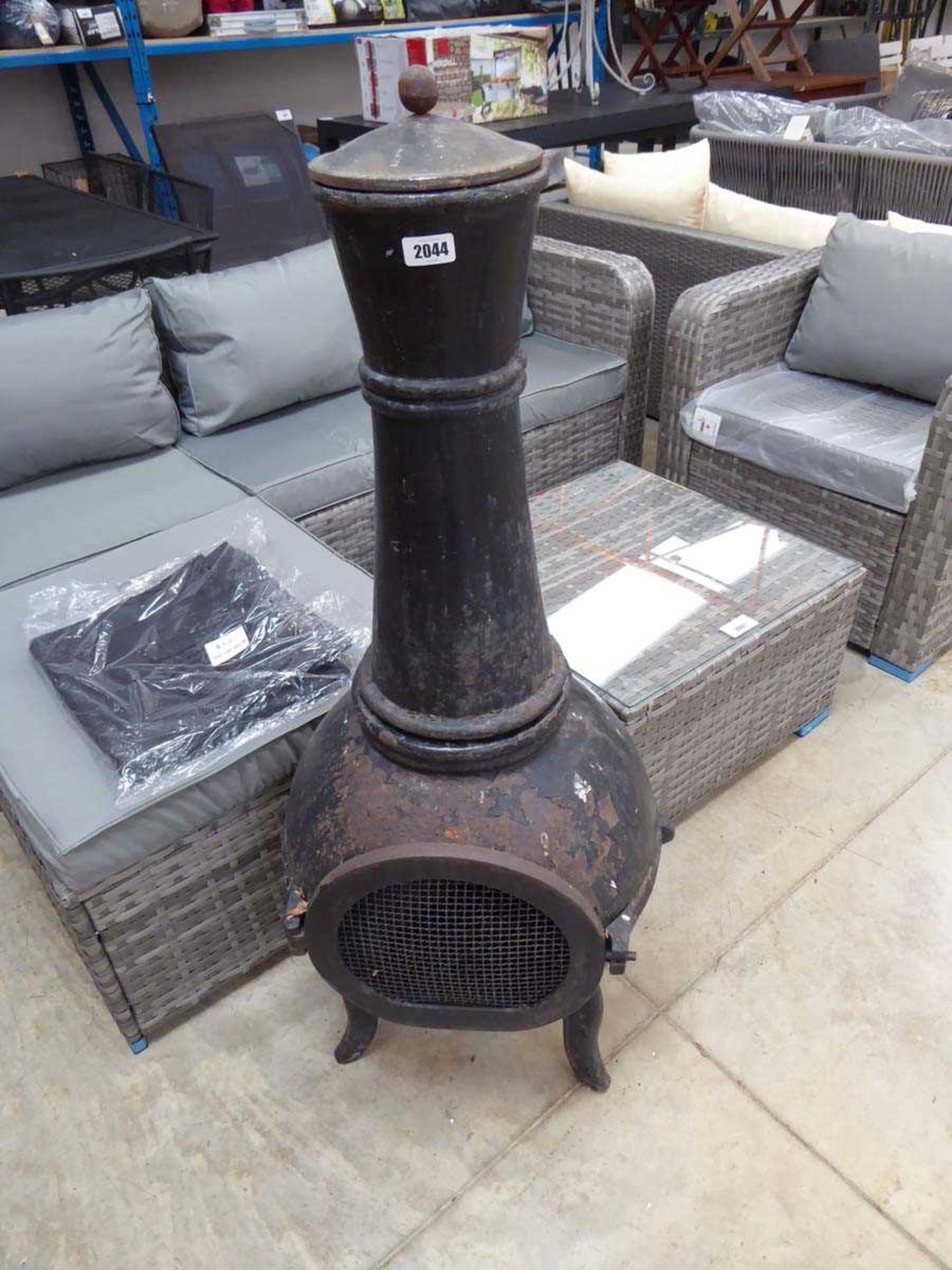 Weathered cast iron outdoor wood burning chiminea