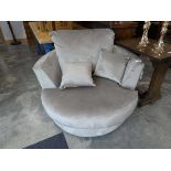+VAT Grey upholstered circular revolving easy chair with cushions