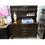 Dark coral dresser with 4 central drawers and 2 cupboards