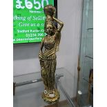 Gilt painted statue of a woman carrying a water jug