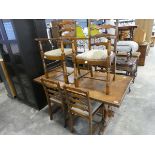 Dark oak refectory type dining table with 6 (4+2) matching striped upholstered dining chairs