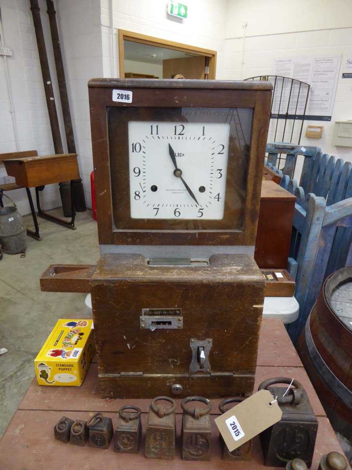 Wooden cased clocking in machine by Blick of Sekforde Street, London