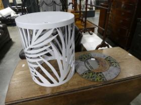 Drum shaped white metal perforated occasional table and a moon framed mirror