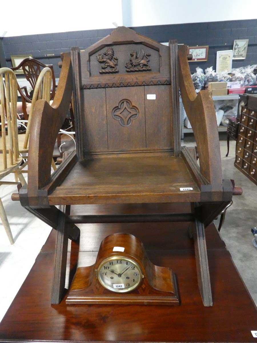 Dark oak reproduction Glastonbury chair with lion and dragon emblems