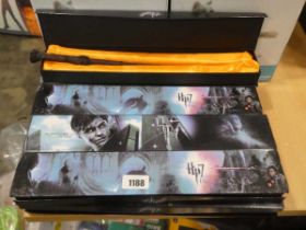 9 Harry Potter wands in display cases