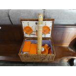 Wicker picker hamper with plastic orange dining set together with a scratch map in tube