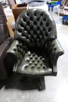 Dark green leather upholstered Chesterfield directors style office swivel armchair