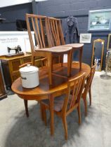 Simulated rosewood oval extending dining table with 6 matching pink upholstered dining chairs