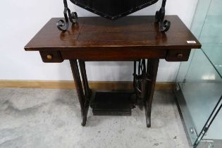 Dark oak based Singer sewing machine stand