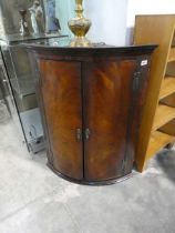 Hanging curved fronted mahogany corner cabinet
