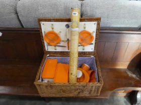 Wicker picker hamper with plastic orange dining set together with a scratch map in tube