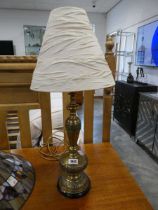 Decorative brass table lantern with rippled cream shade
