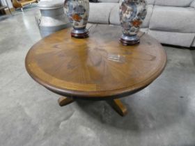 Circular single pedestal coffee table