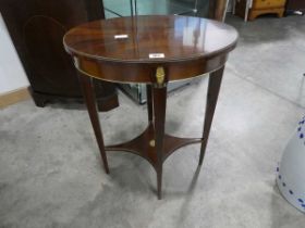 Reproduction mahogany oval center table with gilt detail