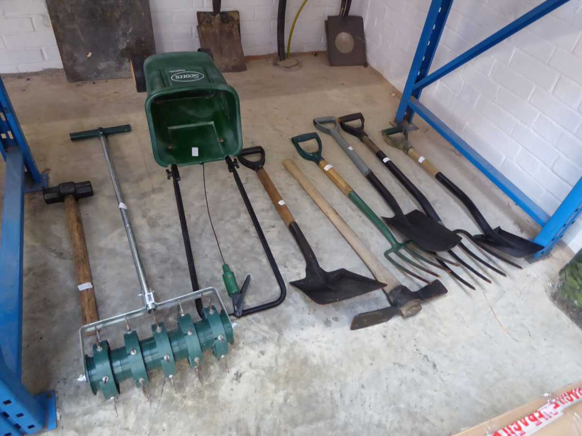 Quantity of mixed garden tools to include forks, shovels, Scotts two wheeled seed spreader, push