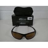 Pair of Korda Developments 4th Dimension sunglasses with gloss black frame and brown lens