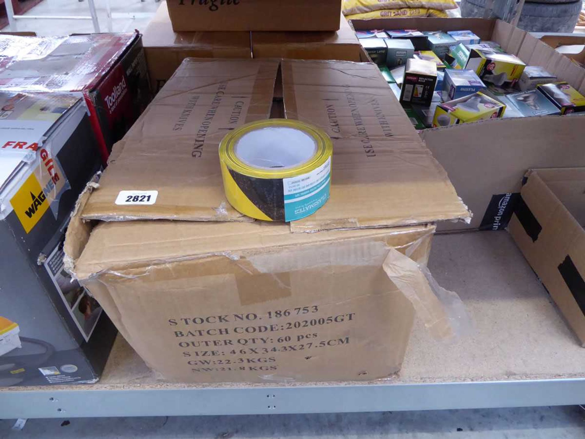 Box containing 60 rolls of black and yellow hazardous tape