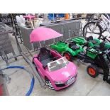 Childs pink push along car in the form of an Audi