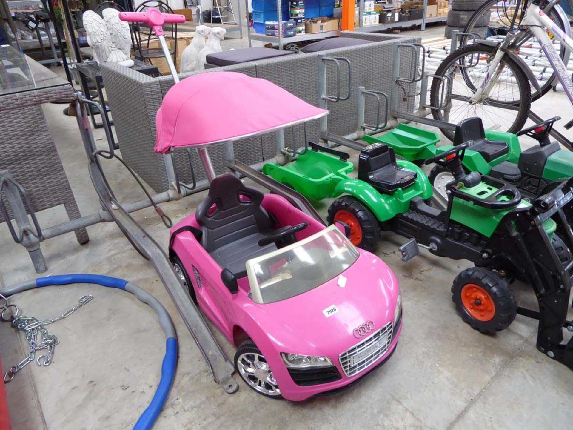 Childs pink push along car in the form of an Audi