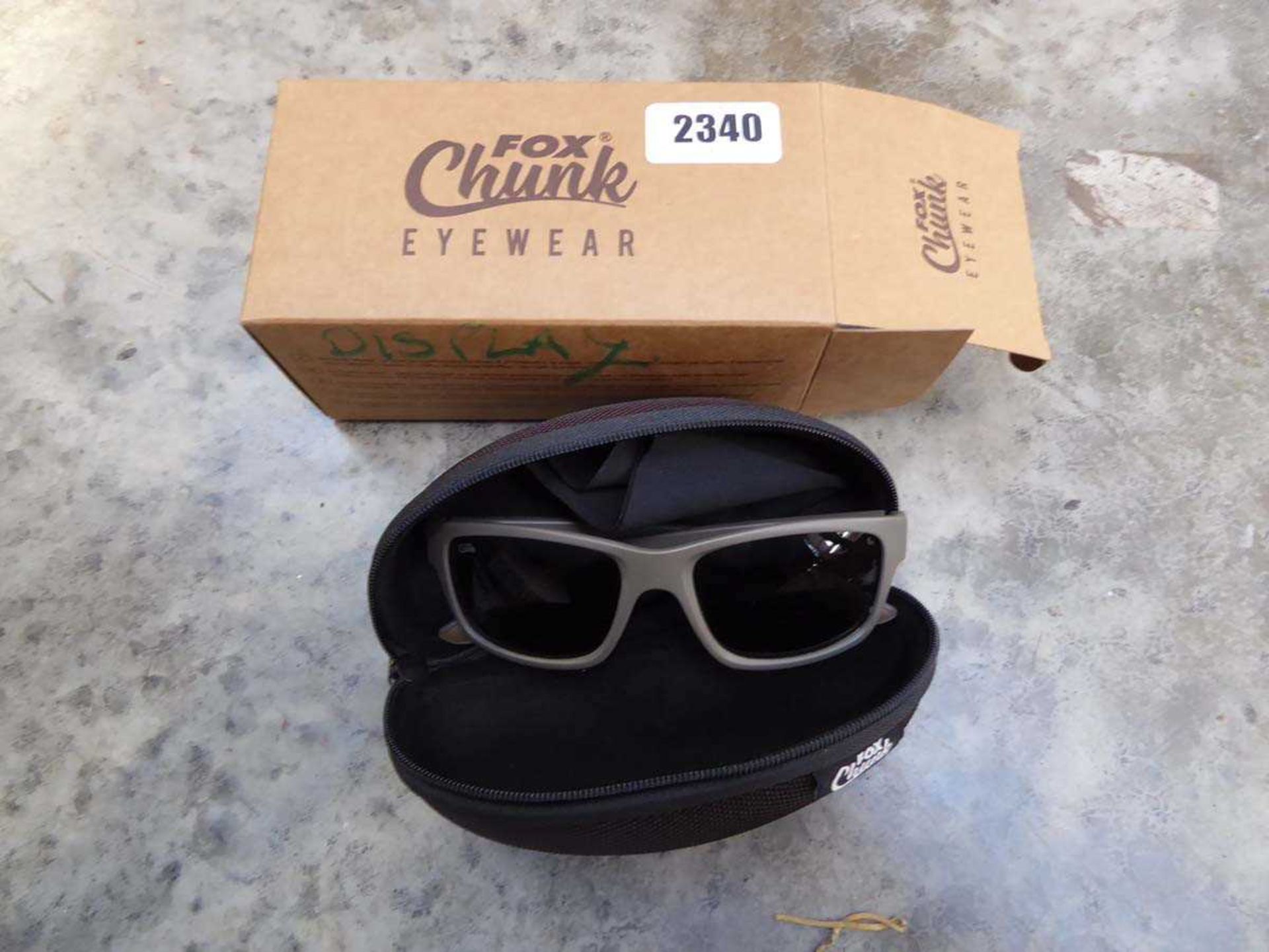 Pair of Fox Chunk eyewear with khaki frame and grey lens