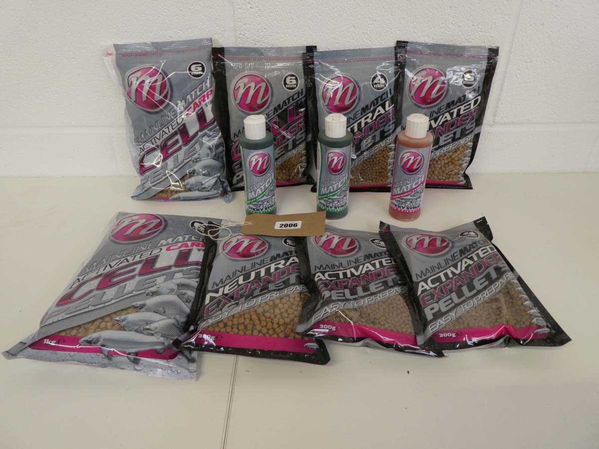 6 packs of Mainline expander pellets with 2 bags of cell pellets and 3 bottles of pellet enhance