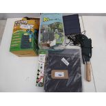 +VAT Bag containing expanding garden hoses, small solar panel, garden cutting tool, weed barrier and