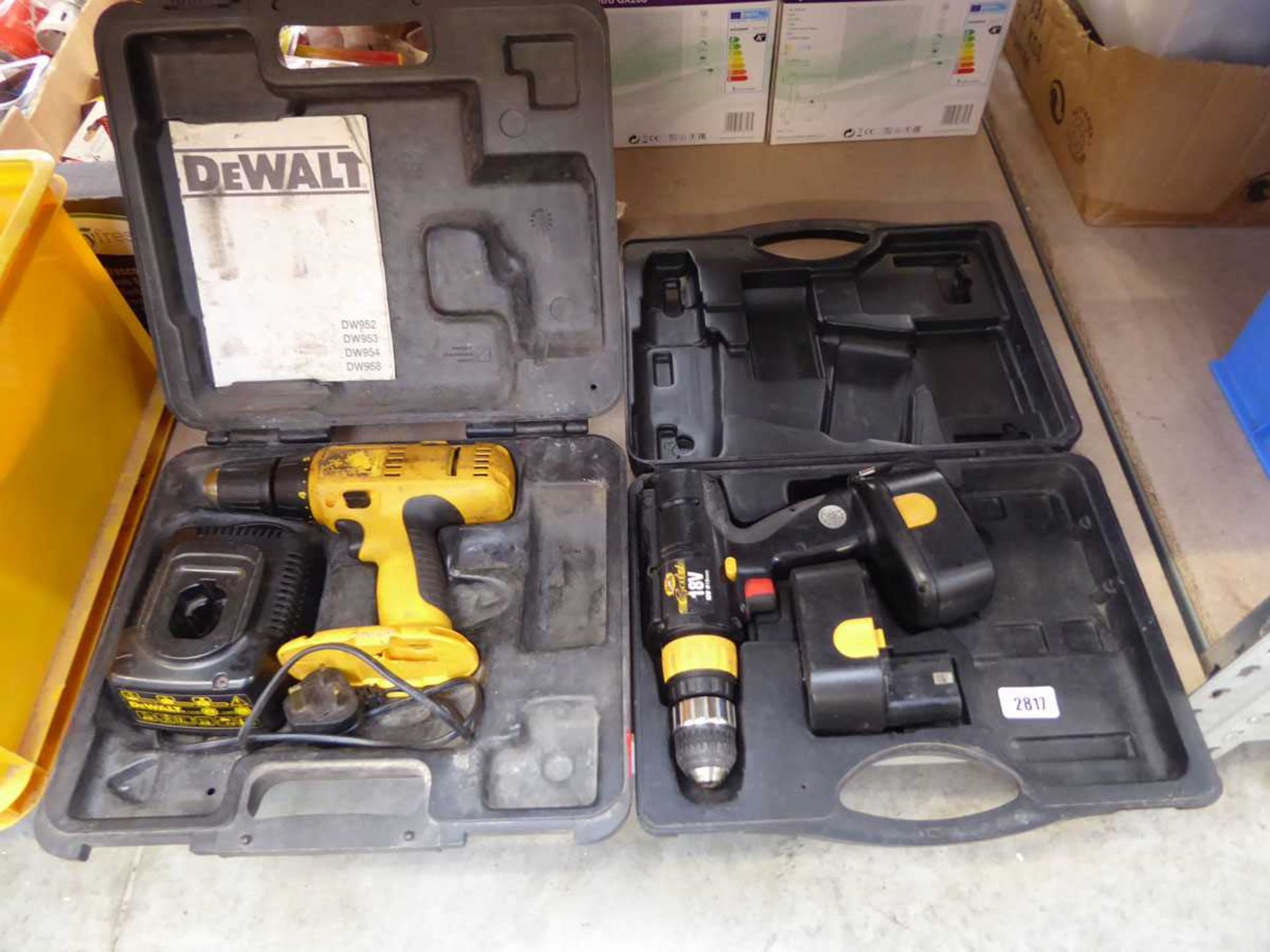 Cased DeWalt drill (no battery) with charger plus cased drill with 2 batteries (no charger)