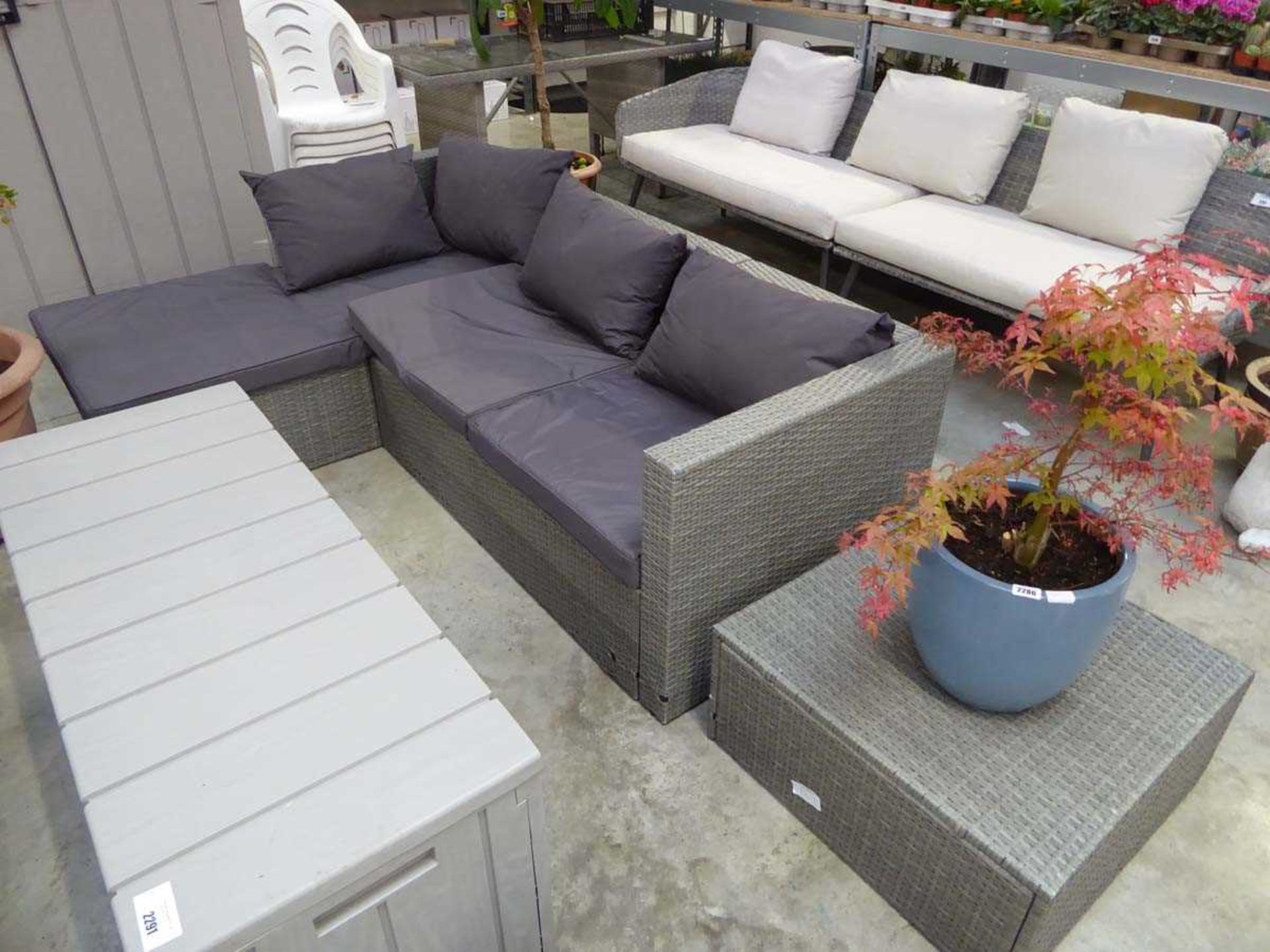 +VAT Grey rattan L-shaped garden sofa set with matching dark grey cushions and matching footstool