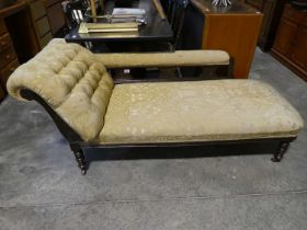 Mahogany framed yellow and gold upholstered chaise on castors