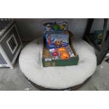 +VAT Brown circular Kirkland signature dog bed, together with a crate of various dogs items, to