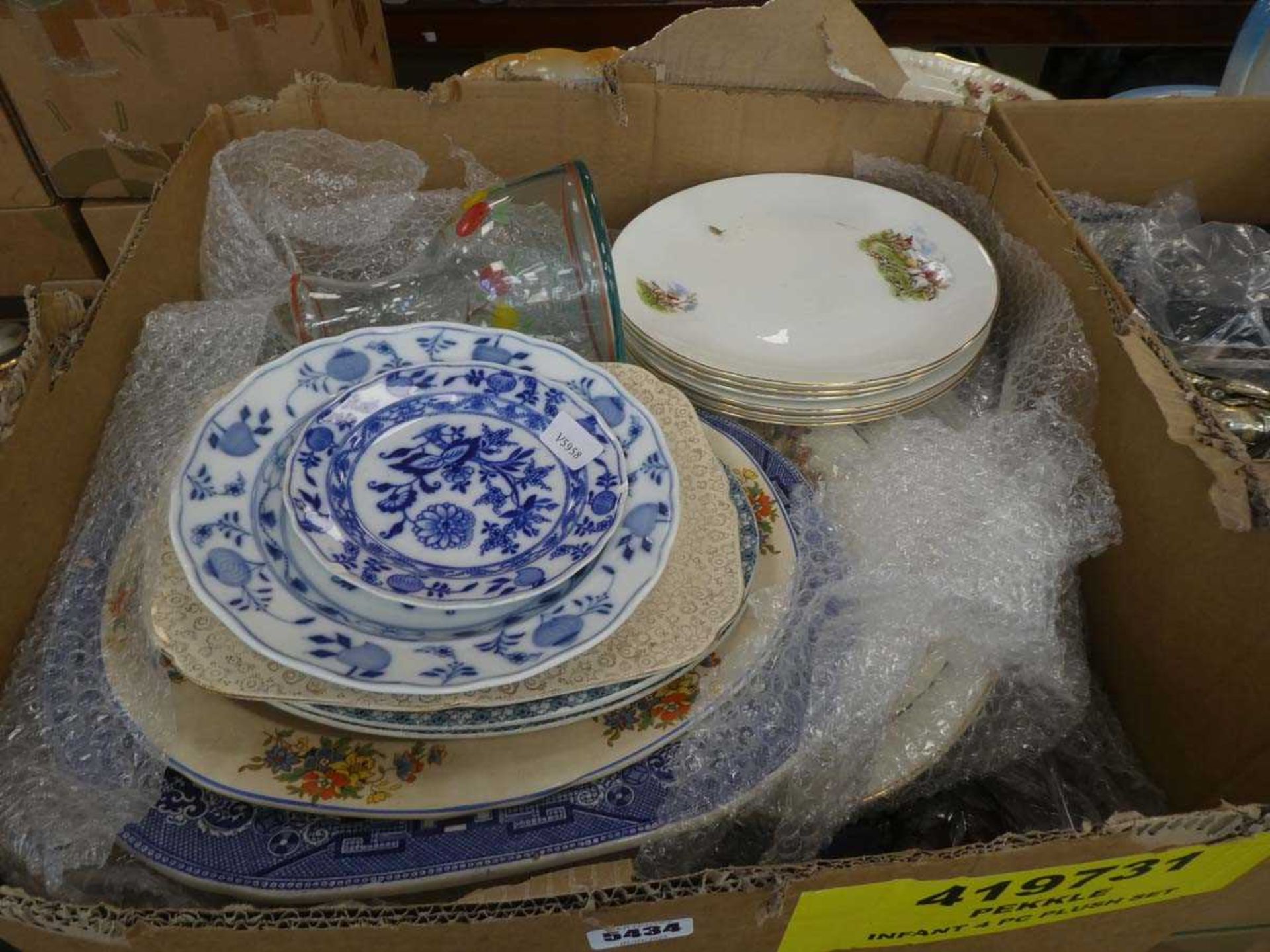 Box containing a large qty of blue and white and hunting patterned crockery, plus wine glasses and