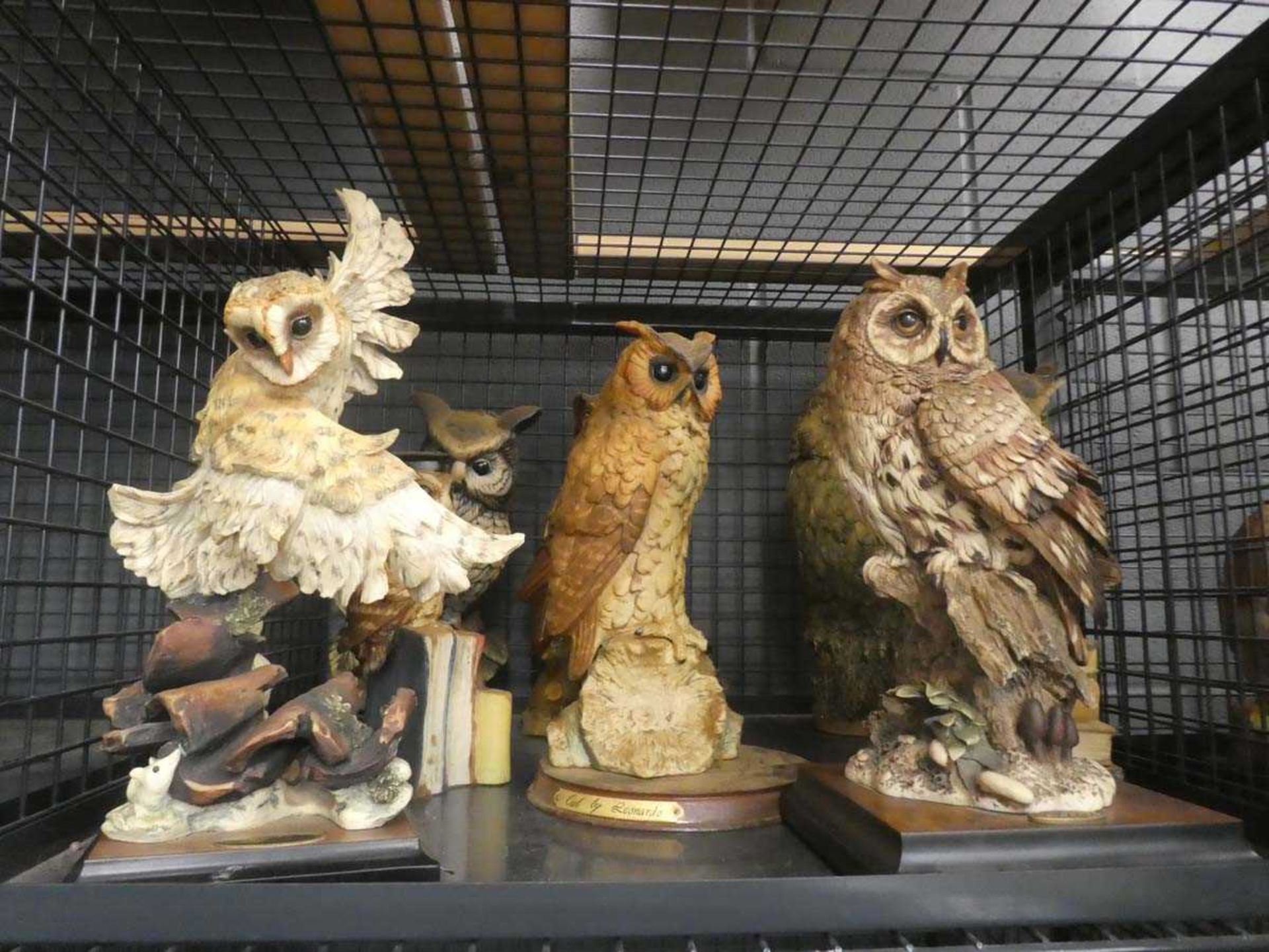 Cage containing ornamental owls