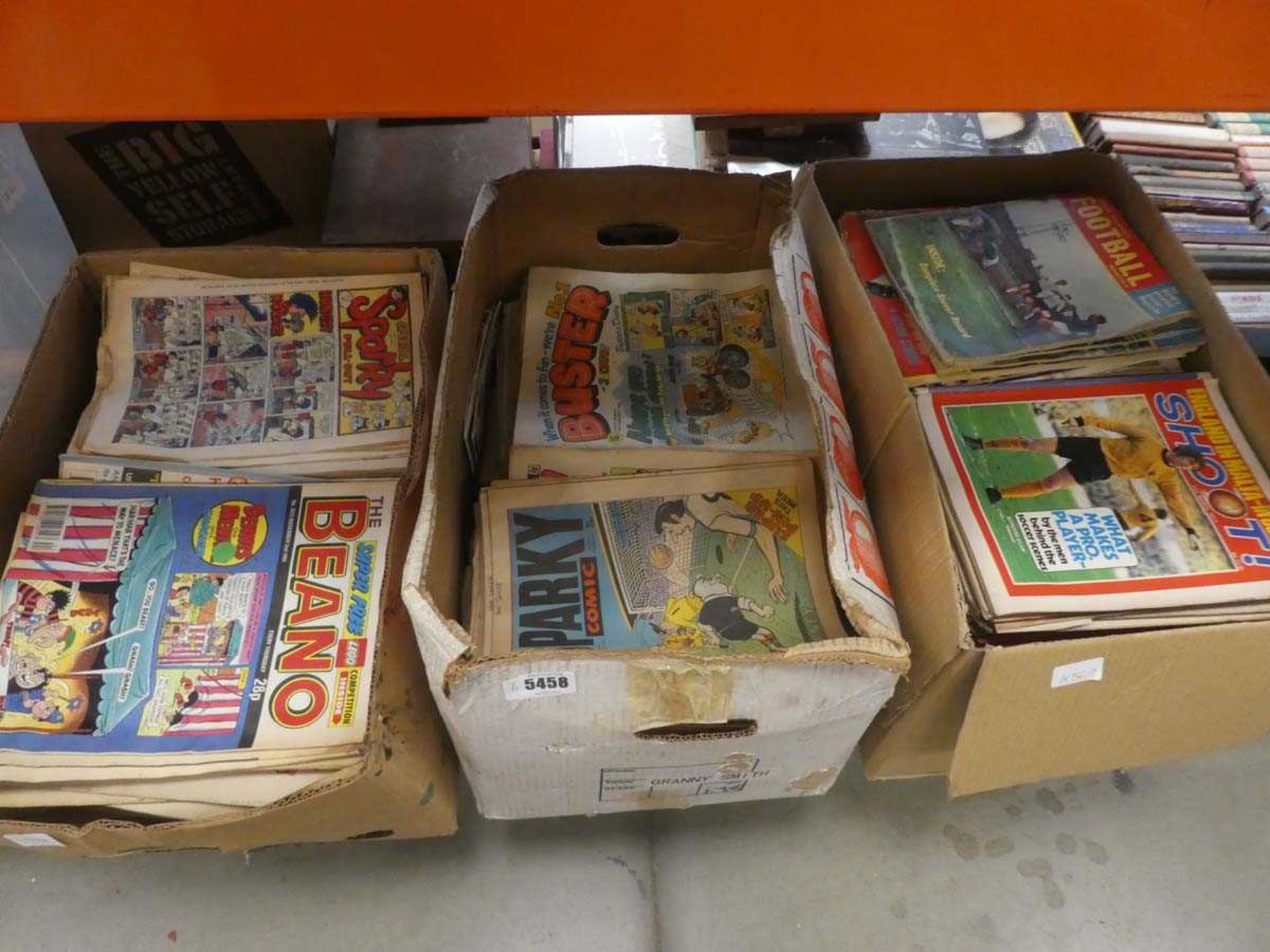 3 boxes containing Shoot, Buster and Beano comics