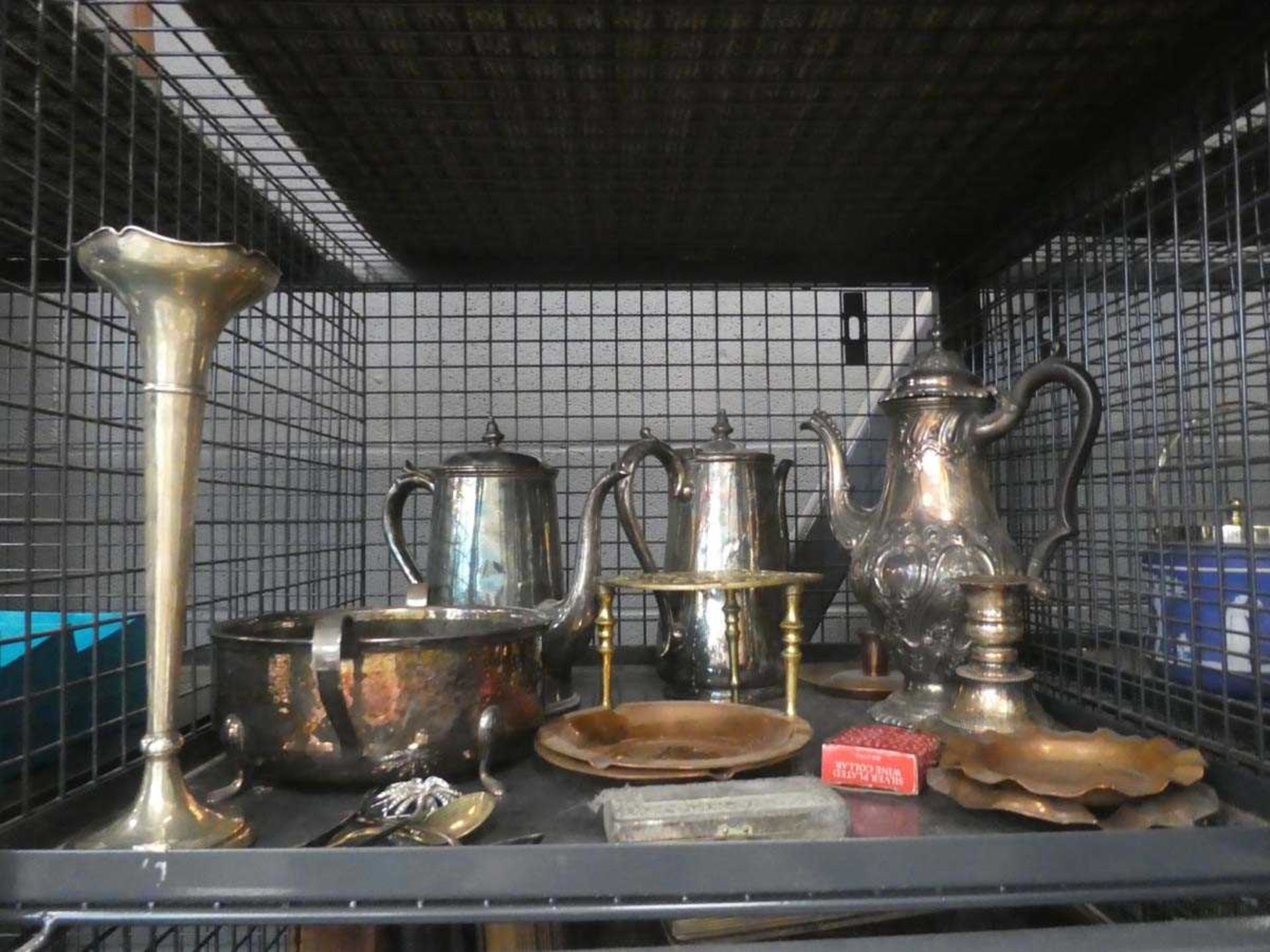 Cage containing copper ash trays, loose cutlery, hot water jugs and a tea pot