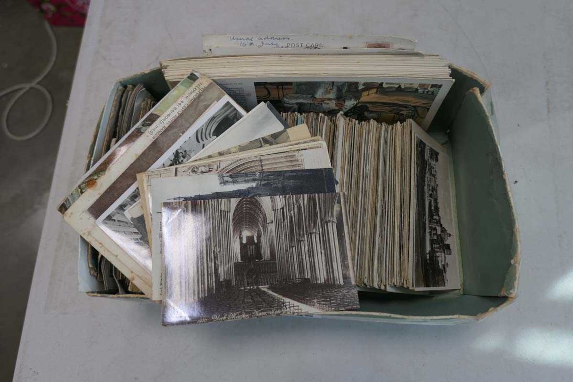 Tray of vintage postcards